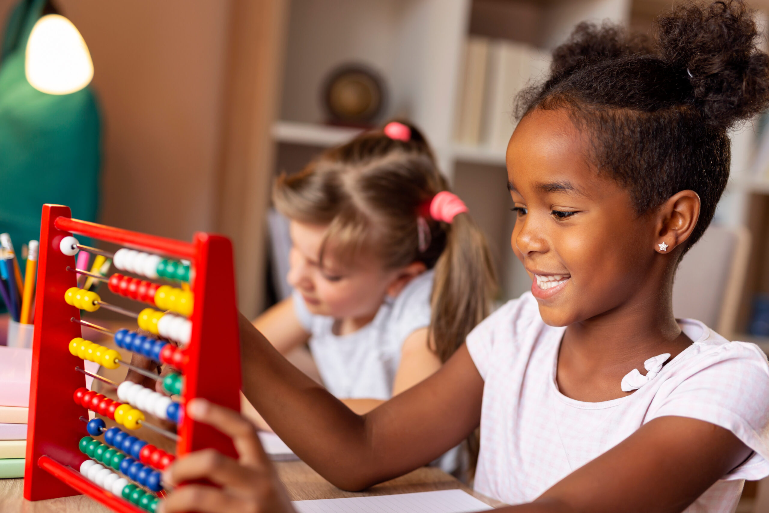 Child learning math with an abacus