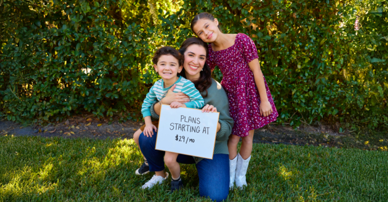 Family holding a sign that says "plans starting at $29/month"